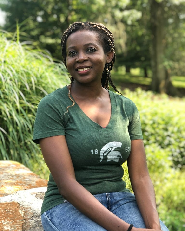 Photograph of Grace in an MSU t-shirt outside
